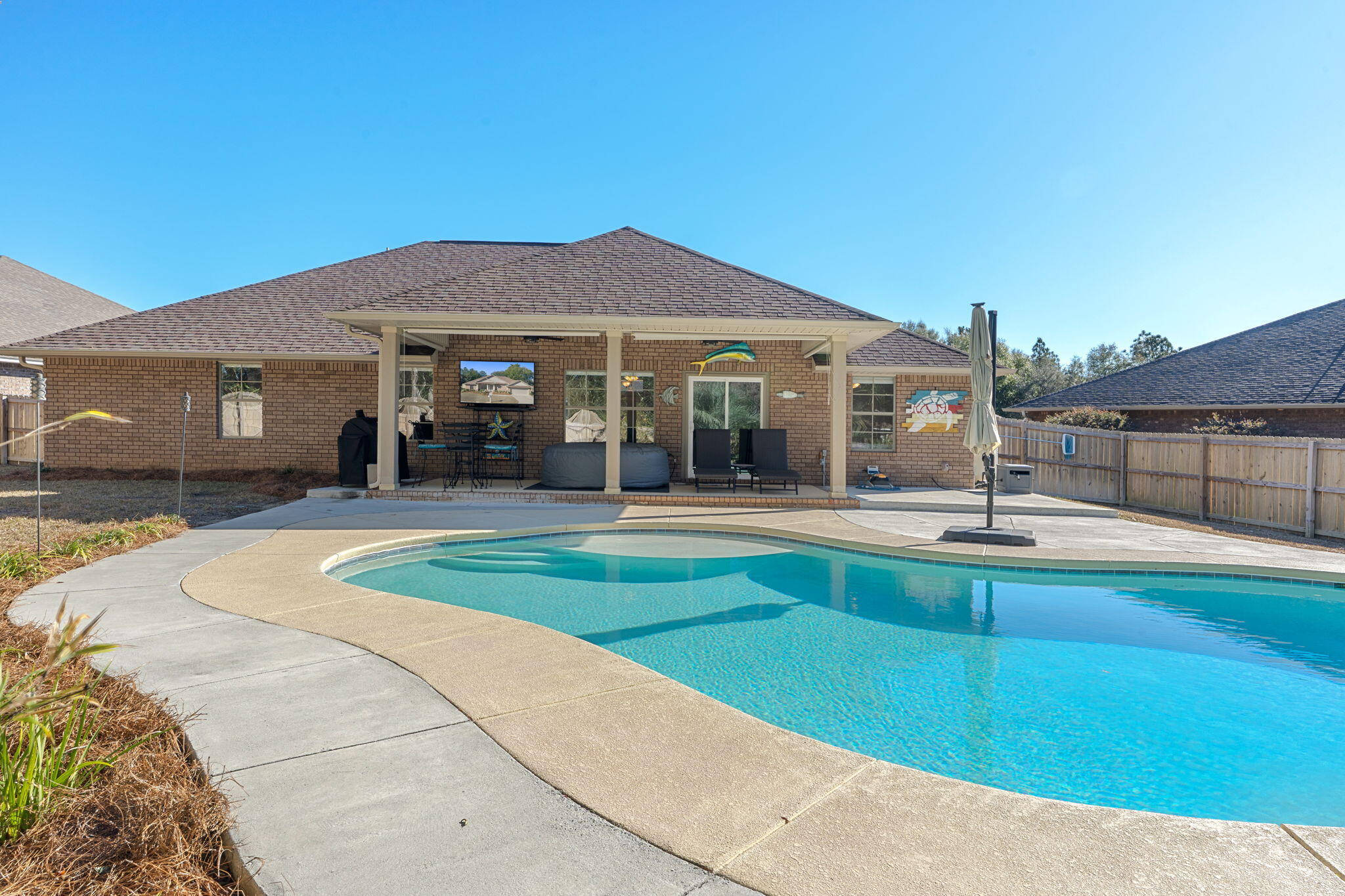 207 Pinque Coat Court Crestview, FL 32536 - Photo 3 of 47 a view of a house with a swimming pool