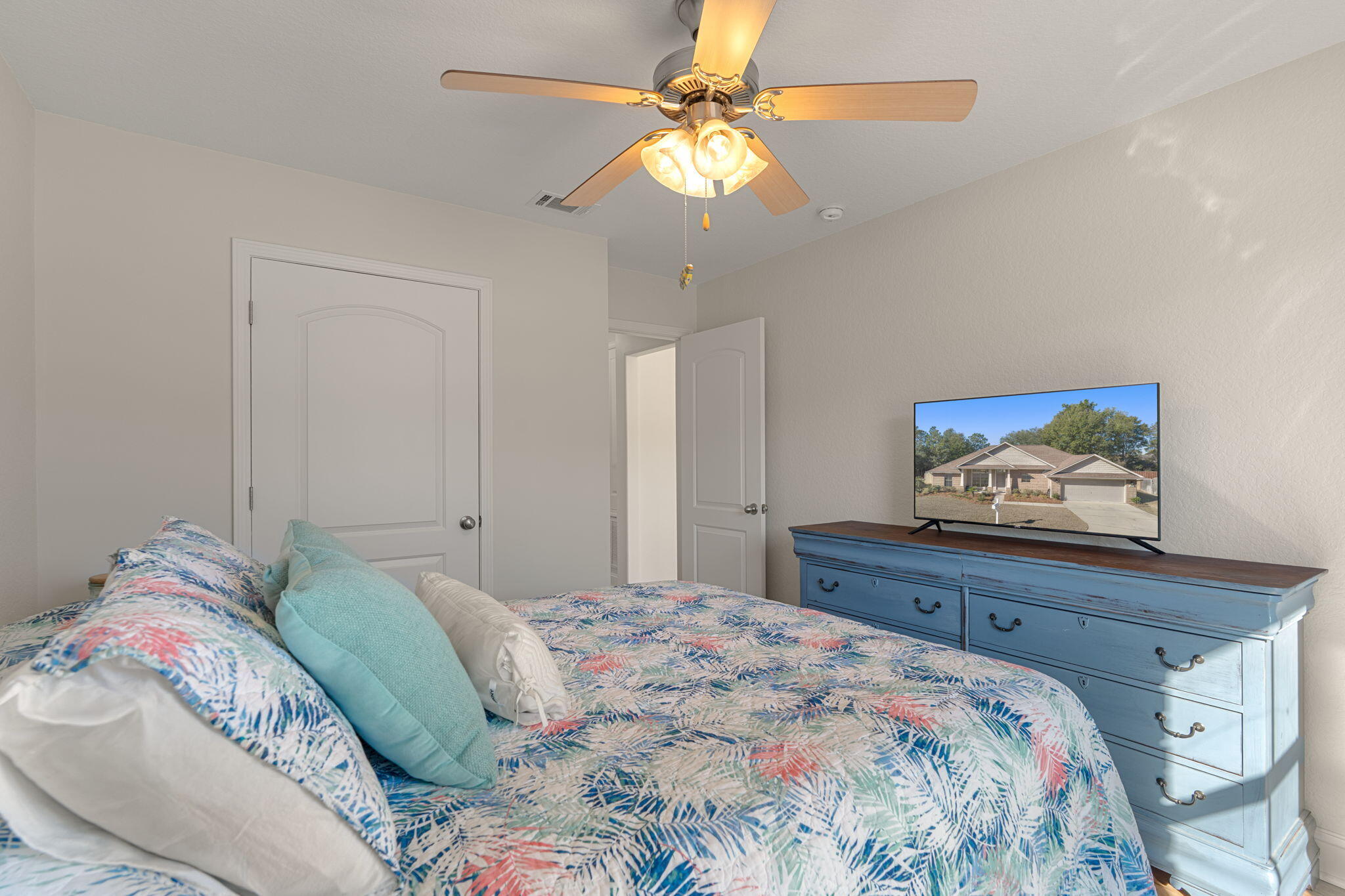 207 Pinque Coat Court Crestview, FL 32536 - Photo 32 of 47 a bedroom with a bed and a chandelier