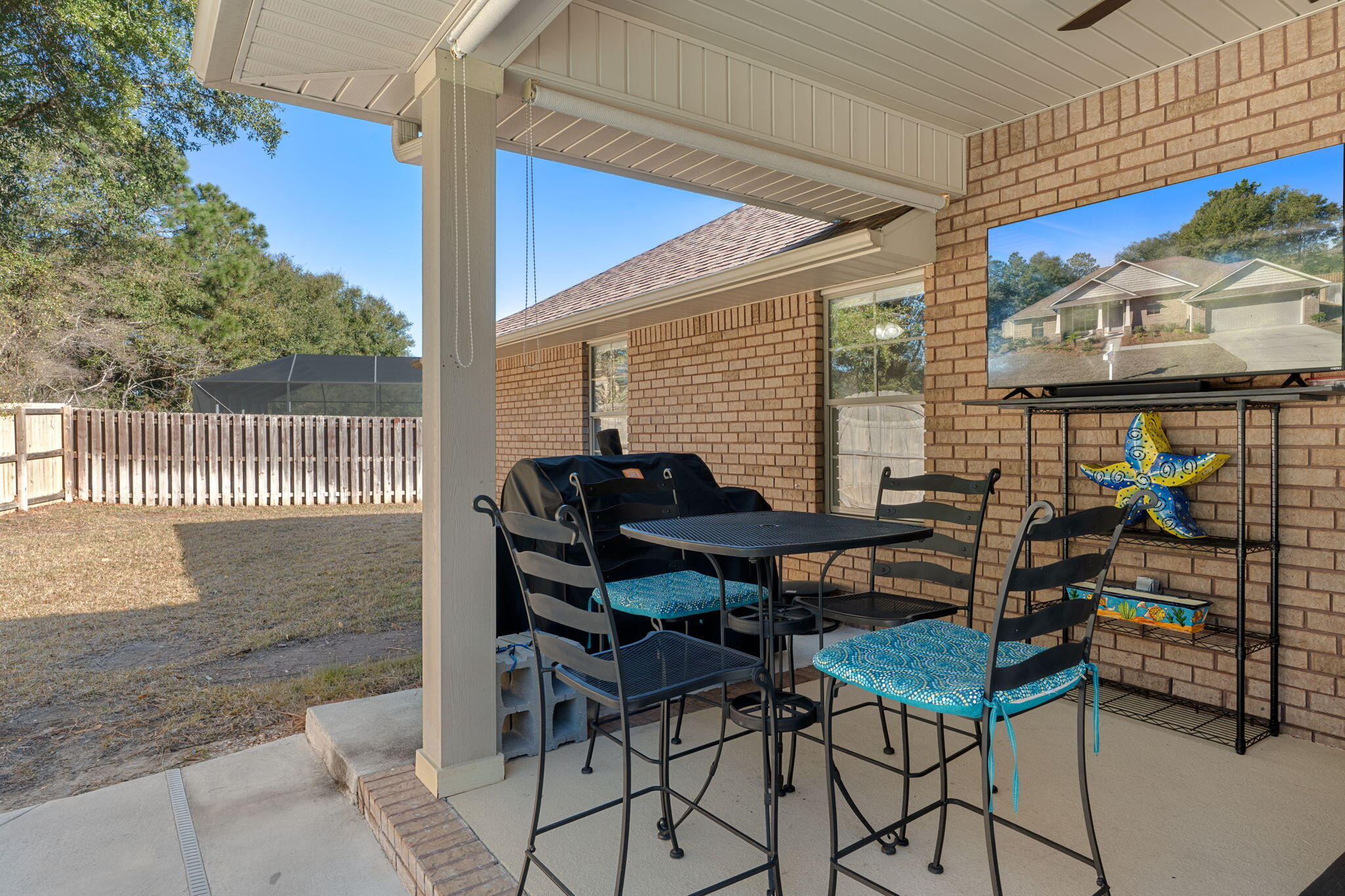 207 Pinque Coat Court Crestview, FL 32536 - Photo 37 of 47 a view of a patio with a table and chairs