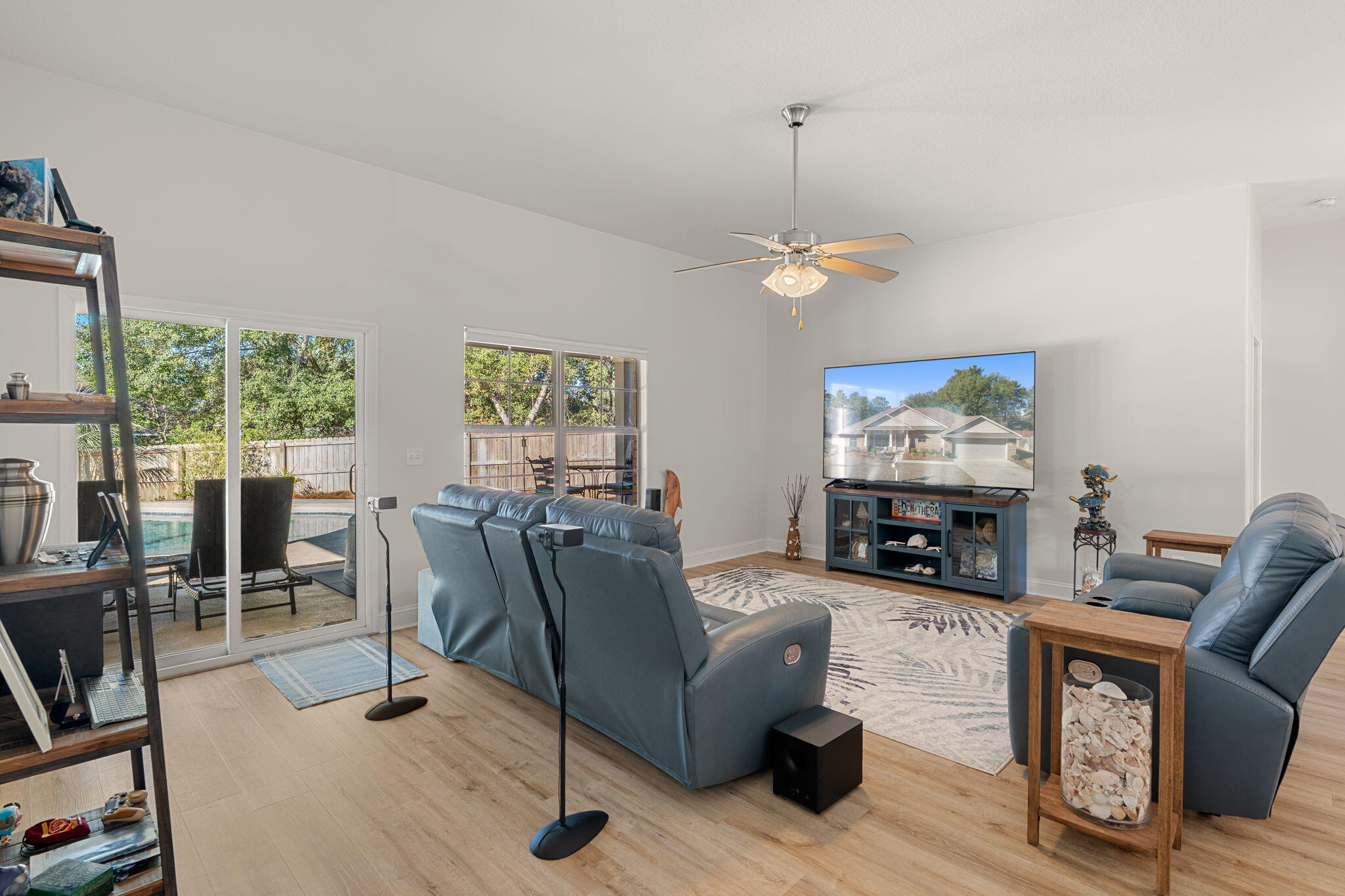 207 Pinque Coat Court Crestview, FL 32536 - Photo 10 of 47 a living room with furniture a fireplace and a flat screen tv
