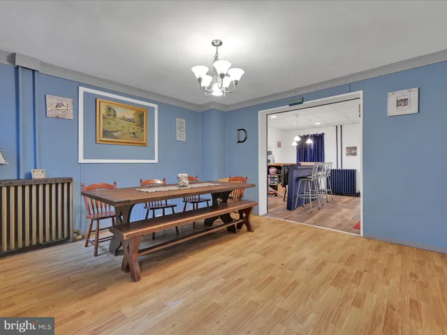 a room with furniture pool table and window