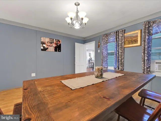 a bed sitting in a spacious bedroom next to a window