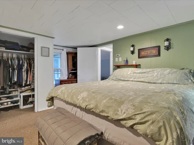 a bedroom with a bed and a view living room