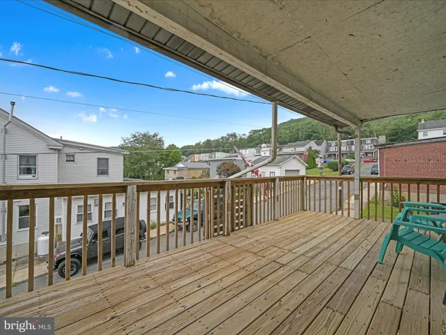 a balcony with wooden floor