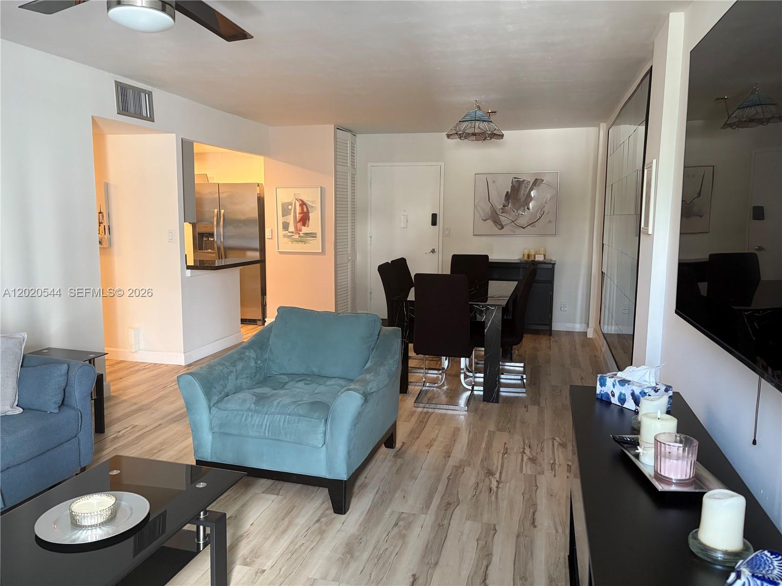 1913 South Ocean Drive, Unit 427 Hallandale Beach, FL 33009 - Photo 5 of 16 a living room with furniture and wooden floor