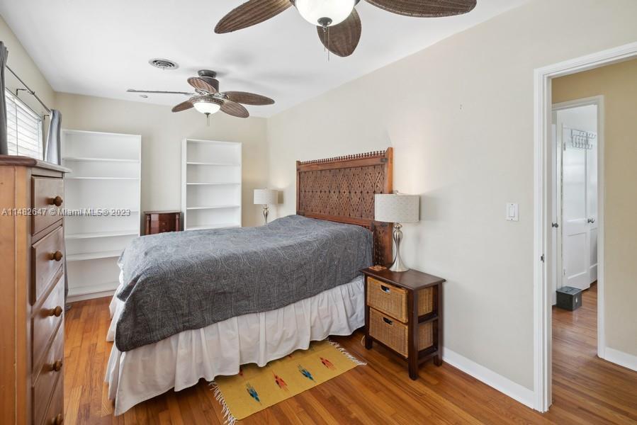 3531 Southwest 13th Street Miami, FL 33135 - Photo 14 of 25 a bedroom with a bed and wooden floor