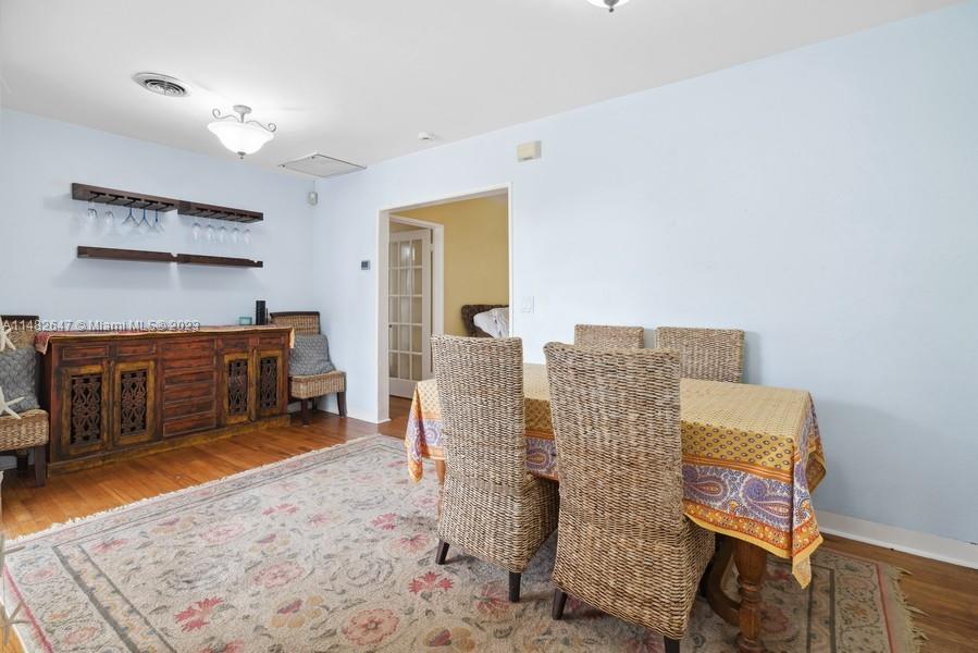 3531 Southwest 13th Street Miami, FL 33135 - Photo 6 of 25 a spacious bedroom with a bed and a cabinets