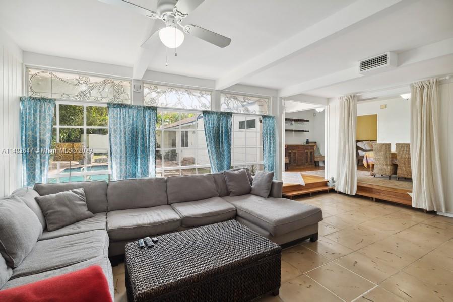 3531 Southwest 13th Street Miami, FL 33135 - Photo 10 of 25 a living room with furniture and a large window