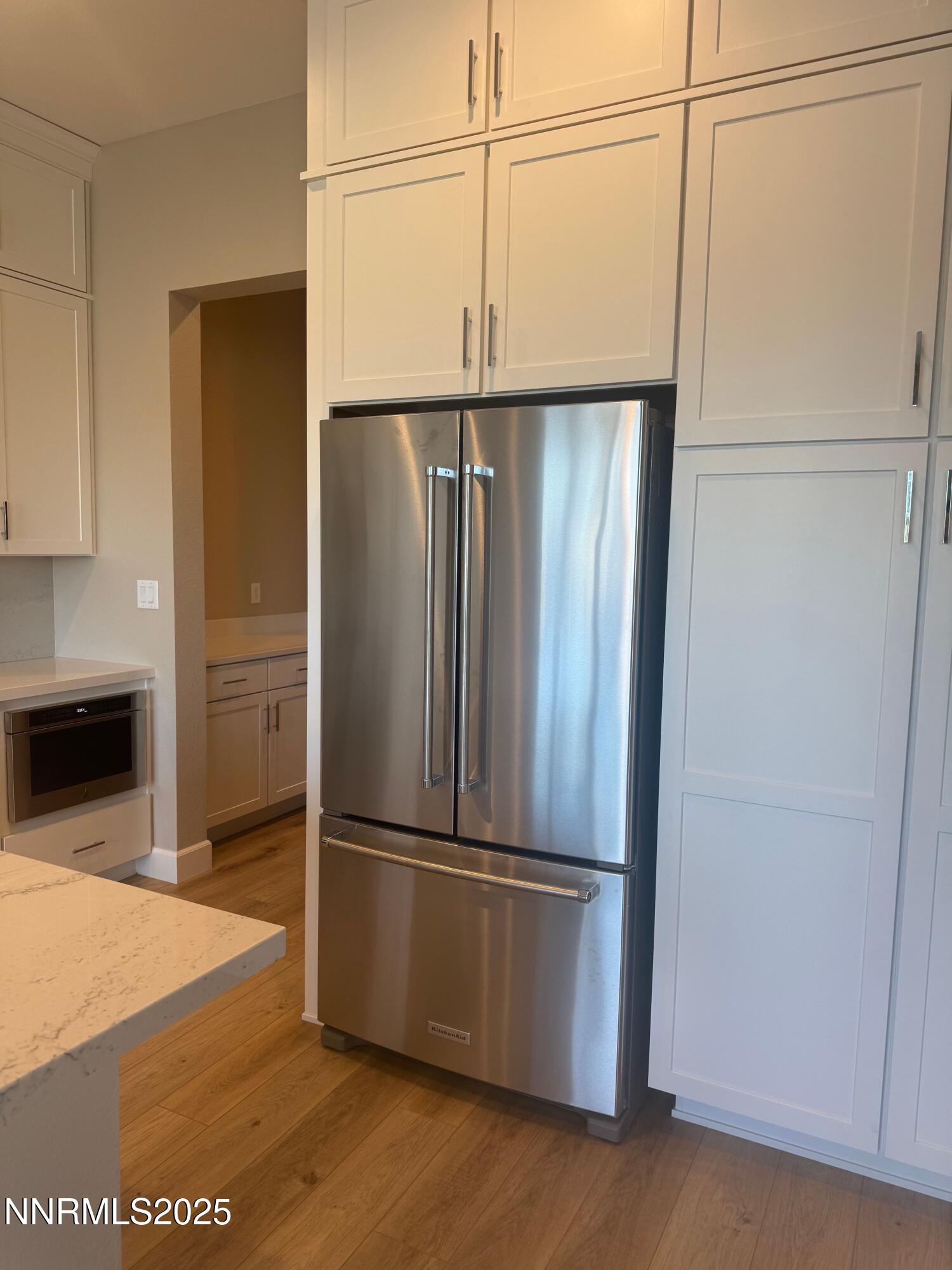 1517 Golf Club Drive Reno, NV 89519 - Photo 14 of 49 a metallic refrigerator freezer sitting in a kitchen