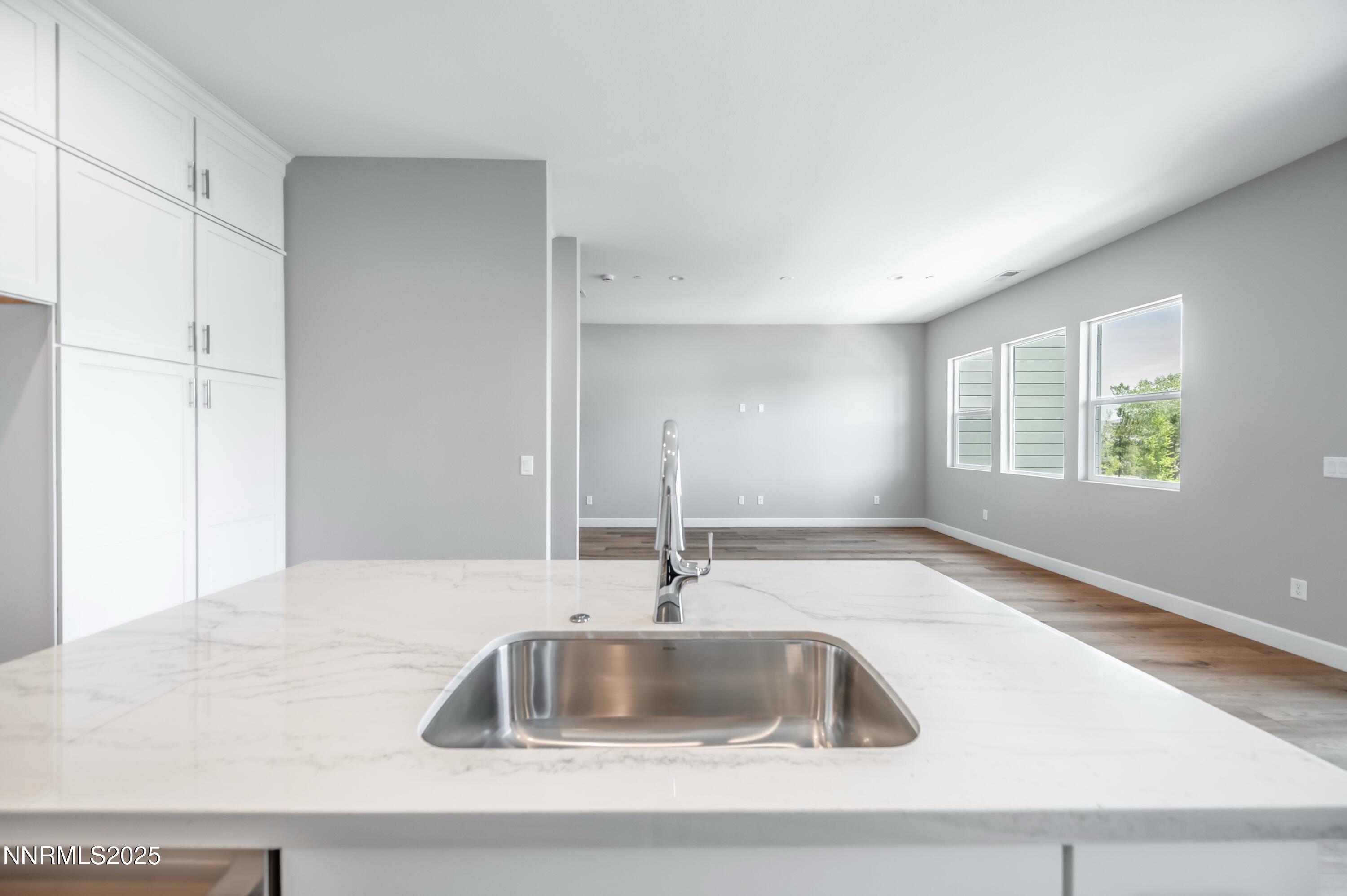 1517 Golf Club Drive Reno, NV 89519 - Photo 17 of 49 a kitchen with granite countertop a sink and a window