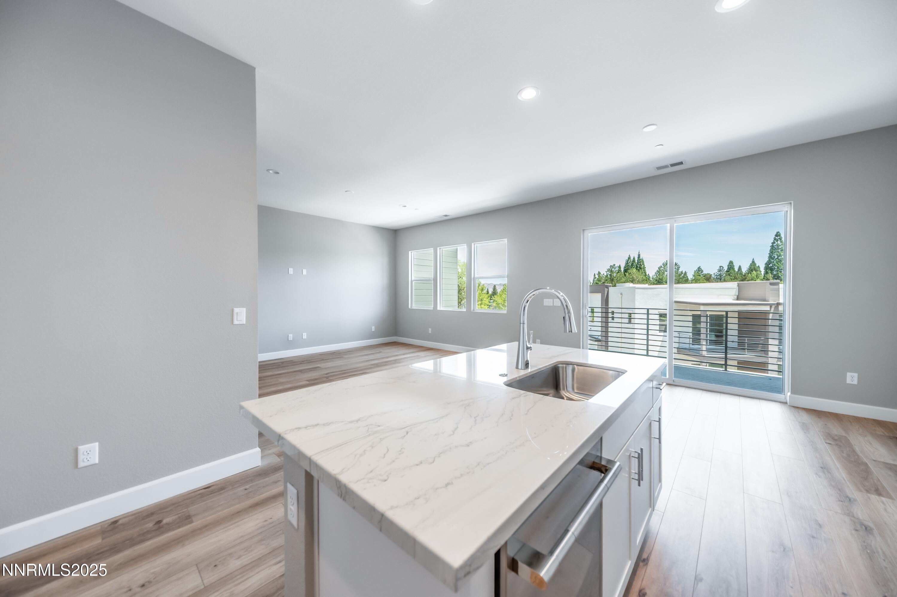 1517 Golf Club Drive Reno, NV 89519 - Photo 18 of 49 a kitchen with a wooden floor and window