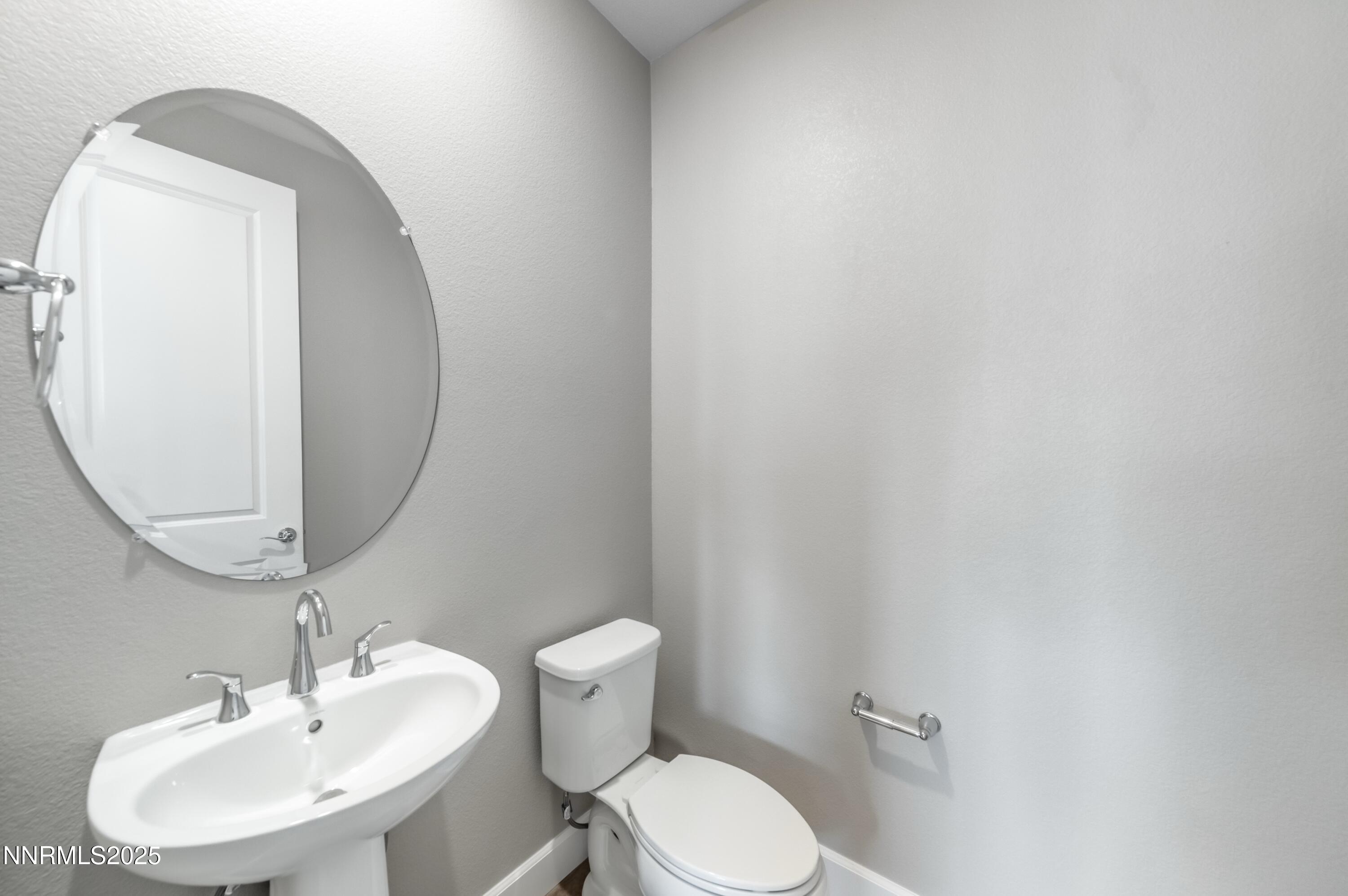 1517 Golf Club Drive Reno, NV 89519 - Photo 21 of 49 a bathroom with a toilet sink and mirror