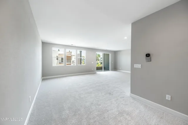 a view of a porch with wooden floor and a window