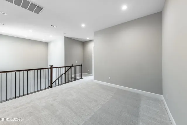 a view of a balcony with wooden floor