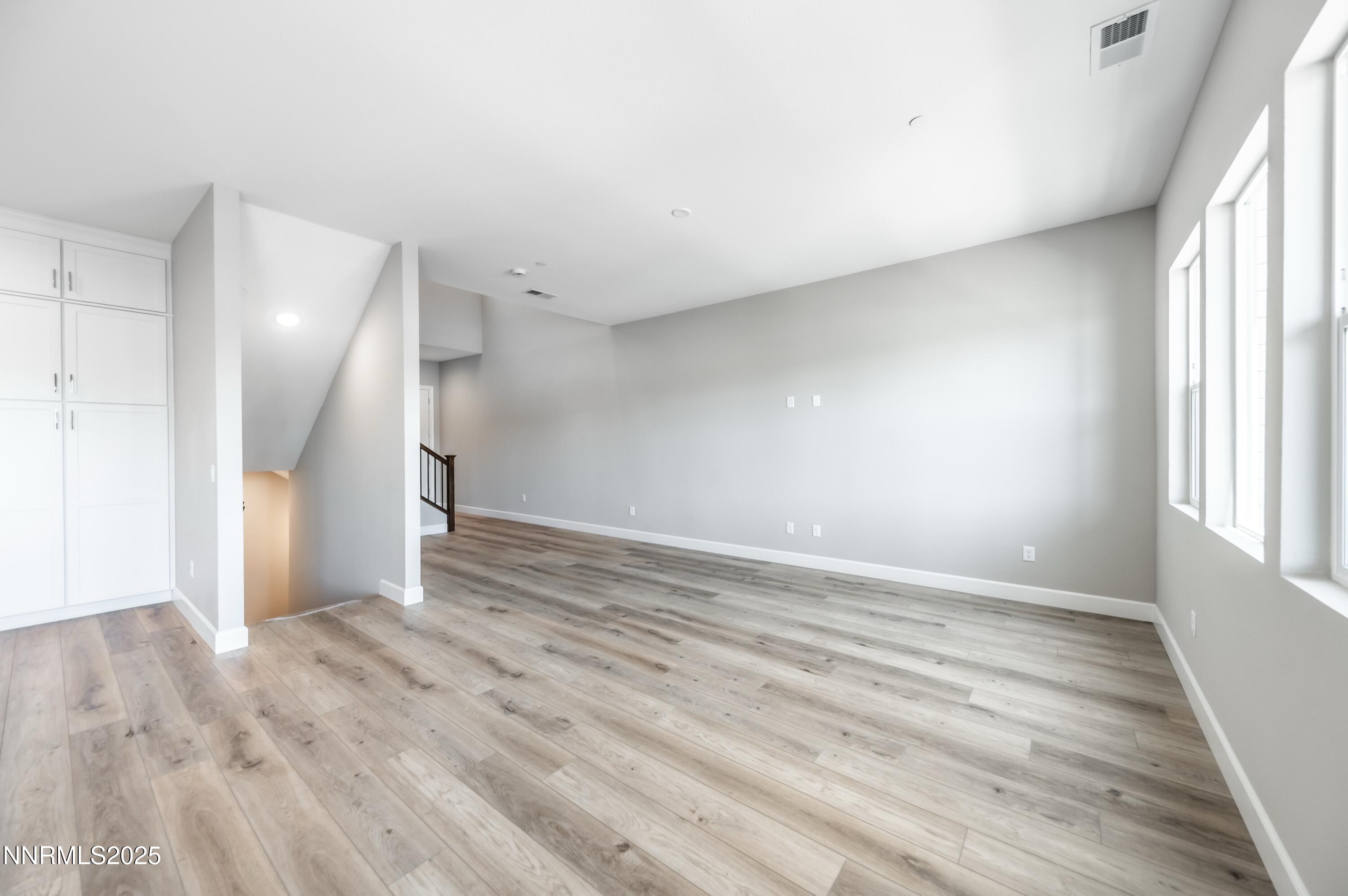 1517 Golf Club Drive Reno, NV 89519 - Photo 6 of 49 an empty room with wooden floor and windows