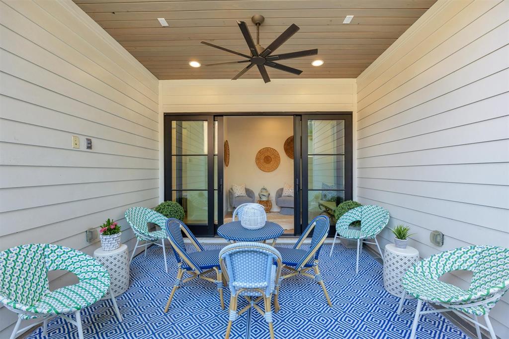 5552 Longview Street Dallas, TX 75206 - Photo 24 of 36 A beautiful set of sliding doors connects this outdoor patio seating area to the conversation spot just inside. There is wiring to hook up your television.