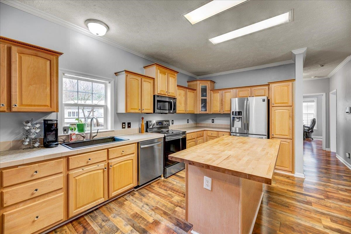 433 Scott Road Cameron, NC 28326 - Photo 11 of 55 a kitchen with stainless steel appliances granite countertop refrigerator sink and cabinets