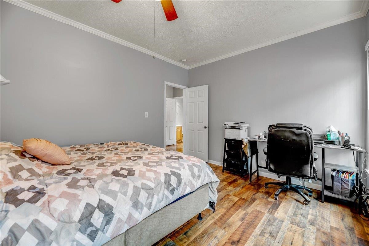 433 Scott Road Cameron, NC 28326 - Photo 19 of 55 a bedroom with a bed and a chair
