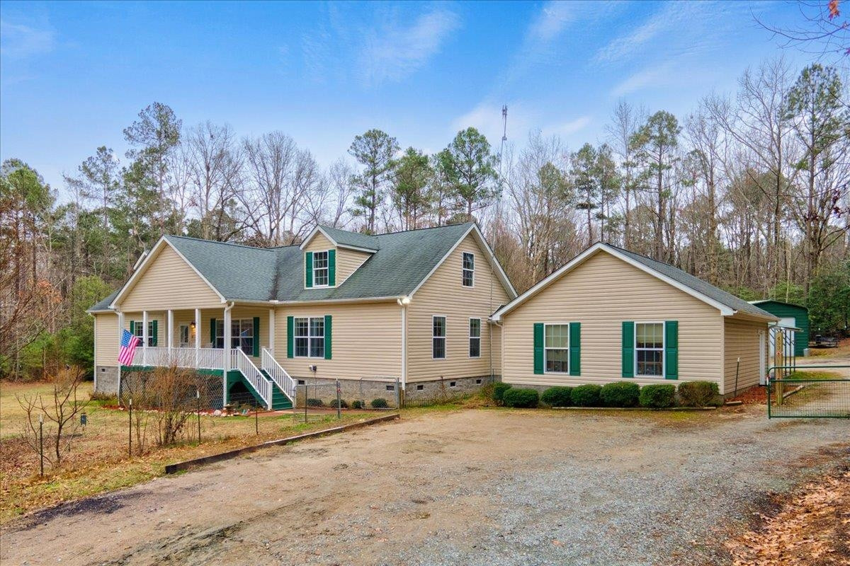 433 Scott Road Cameron, NC 28326 - Photo 3 of 55 a front view of a house with a yard and trees