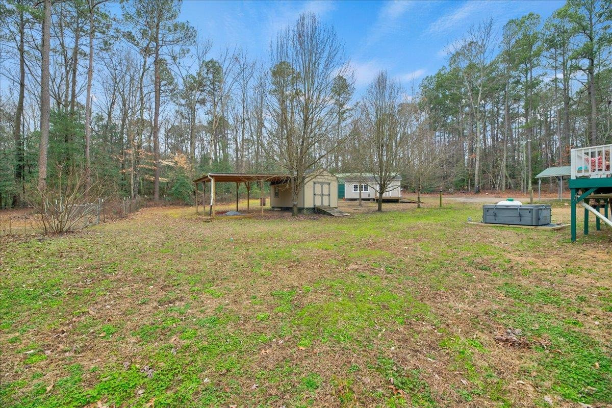 433 Scott Road Cameron, NC 28326 - Photo 36 of 55 a view of a house with a yard and sitting area