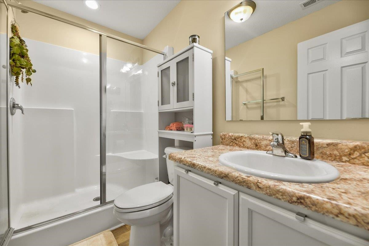 433 Scott Road Cameron, NC 28326 - Photo 49 of 55 a bathroom with a granite countertop sink toilet and shower