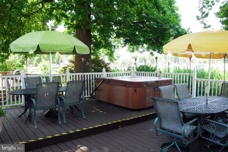 1414 Oak Bluff Road Edgewater, MD 21037 - Photo 8 of 21 a view of a chair and table on the deck