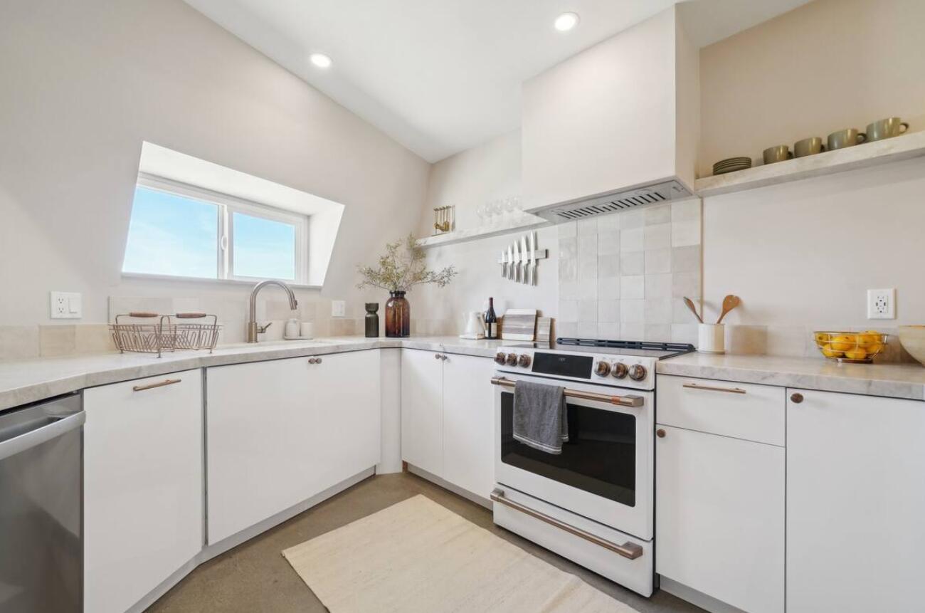 59727 Sharp Terrace Drive Yucca Valley, CA 92284 - Photo 11 of 38 a kitchen with cabinets appliances and a sink
