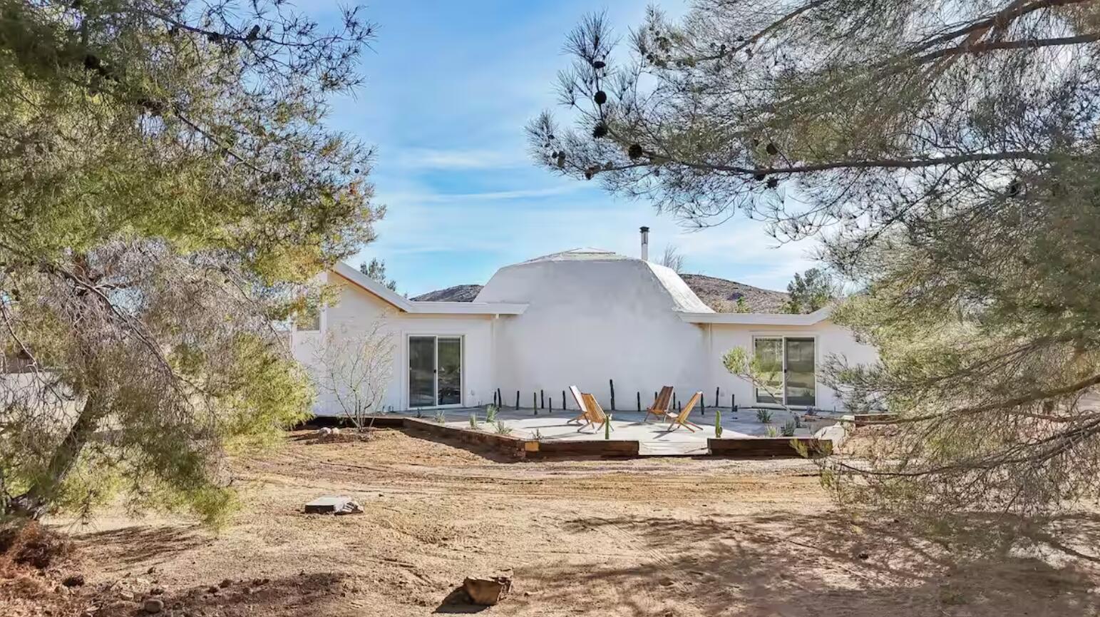 59727 Sharp Terrace Drive Yucca Valley, CA 92284 - Photo 30 of 38 a view of a house with a yard covered in snow