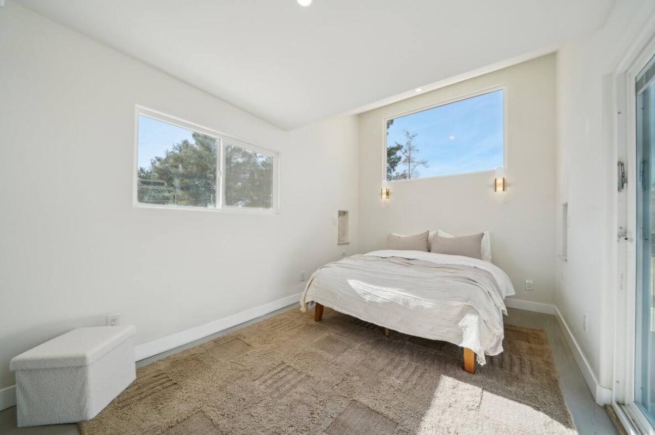 59727 Sharp Terrace Drive Yucca Valley, CA 92284 - Photo 37 of 38 a bedroom with a bed and a painting on the wall