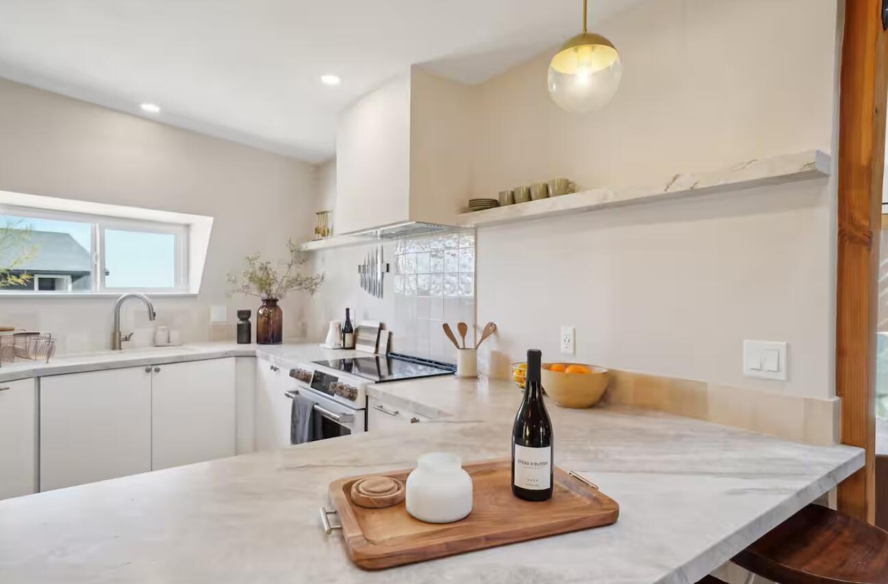 59727 Sharp Terrace Drive Yucca Valley, CA 92284 - Photo 7 of 38 a kitchen with a sink and chairs