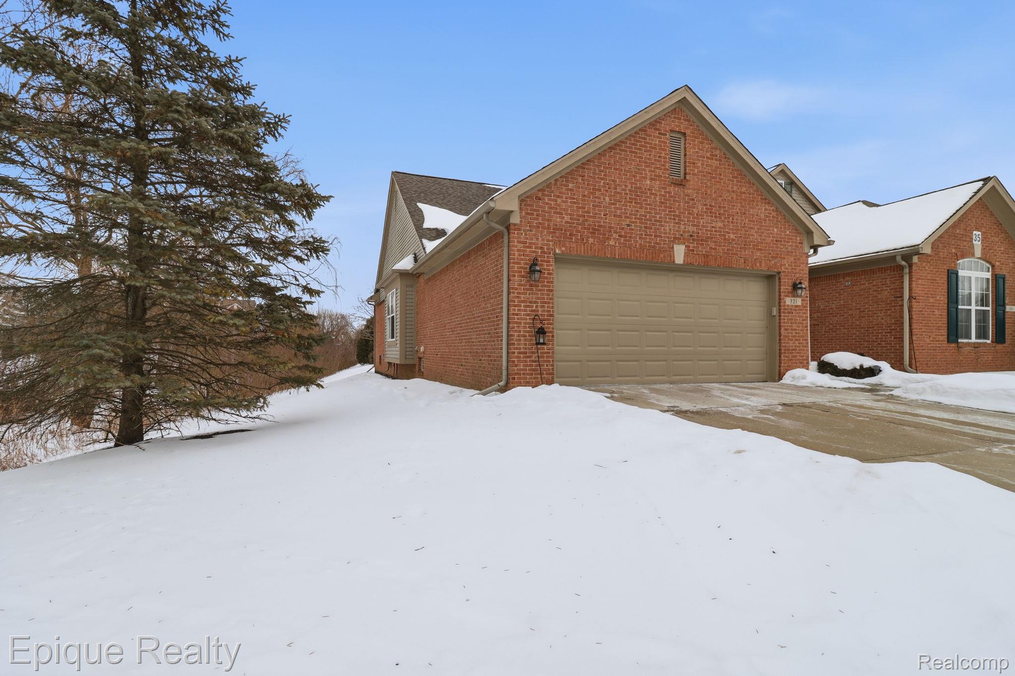 321 Cherry Grove Road Canton, MI 48188 - Photo 2 of 22 View of front of property featuring brick siding and an attached garage