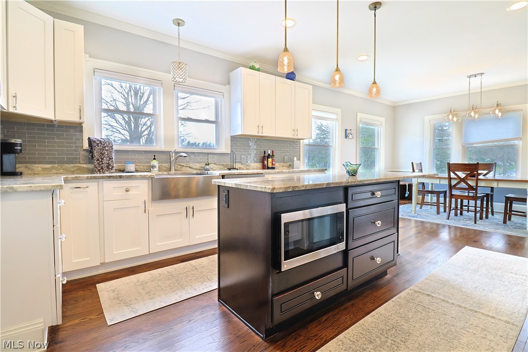 4376 Dover Center Road North Olmsted, OH 44070 - Photo 12 of 34 Kitchen featuring white cabinets and pendant lighting