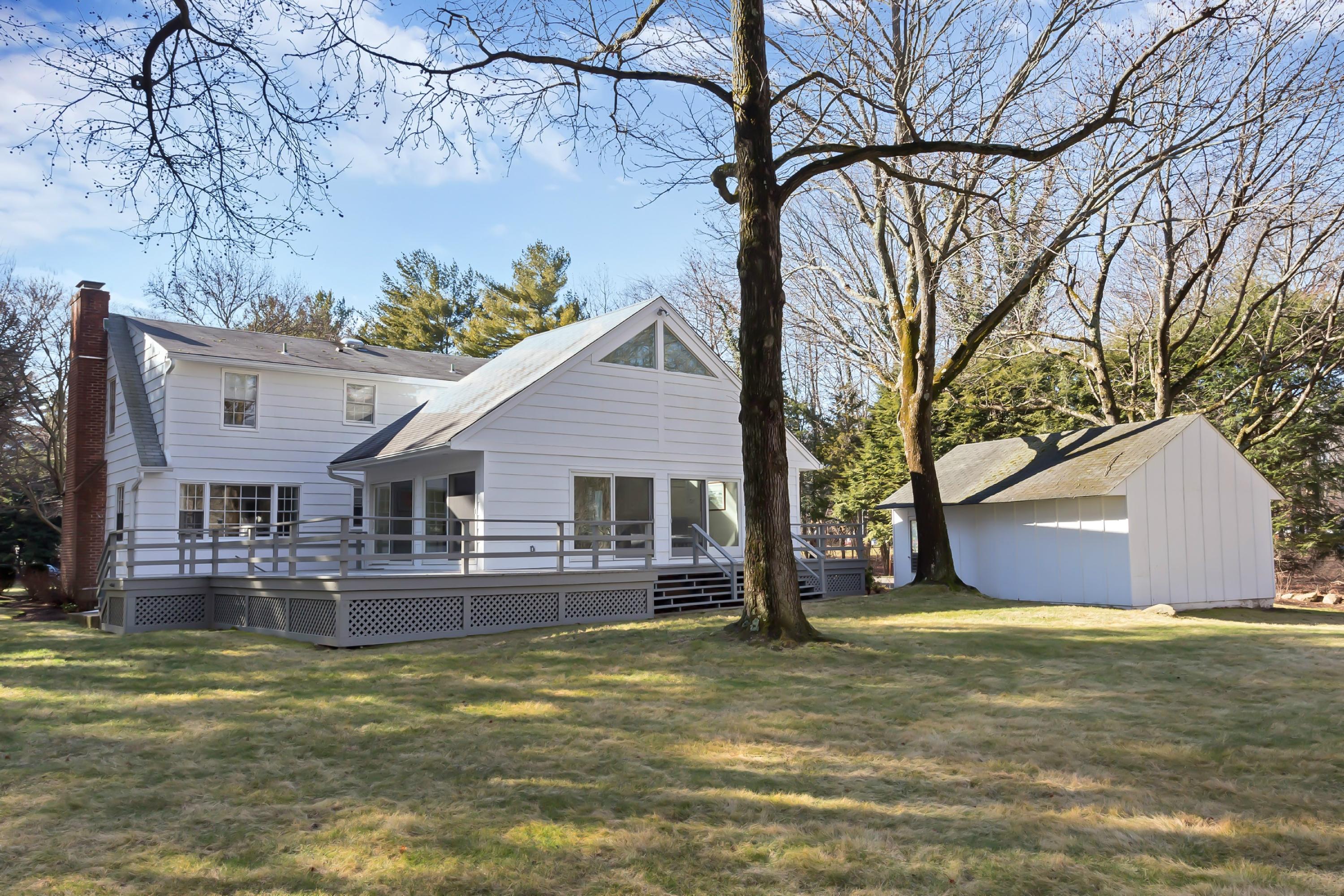 5 Meadow Road Darien, CT 06820 - Photo 20 of 25 a house view with a swimming pool and wooden bench