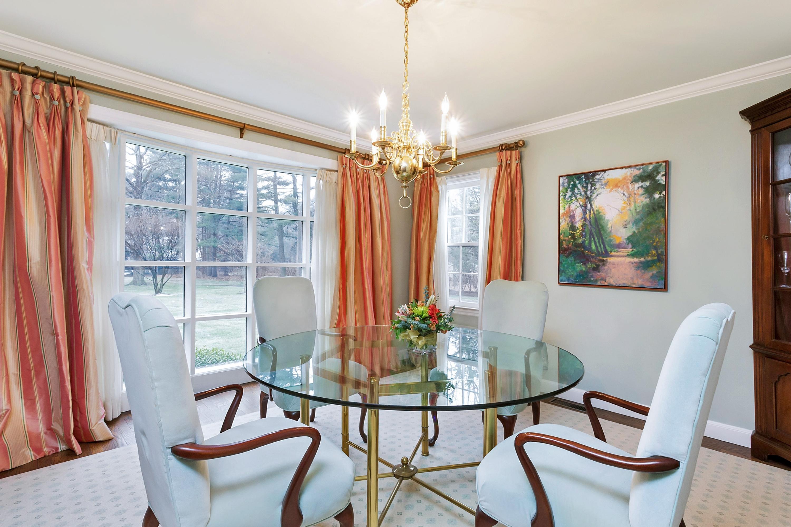 5 Meadow Road Darien, CT 06820 - Photo 4 of 25 a dining room with furniture a chandelier and wooden floor