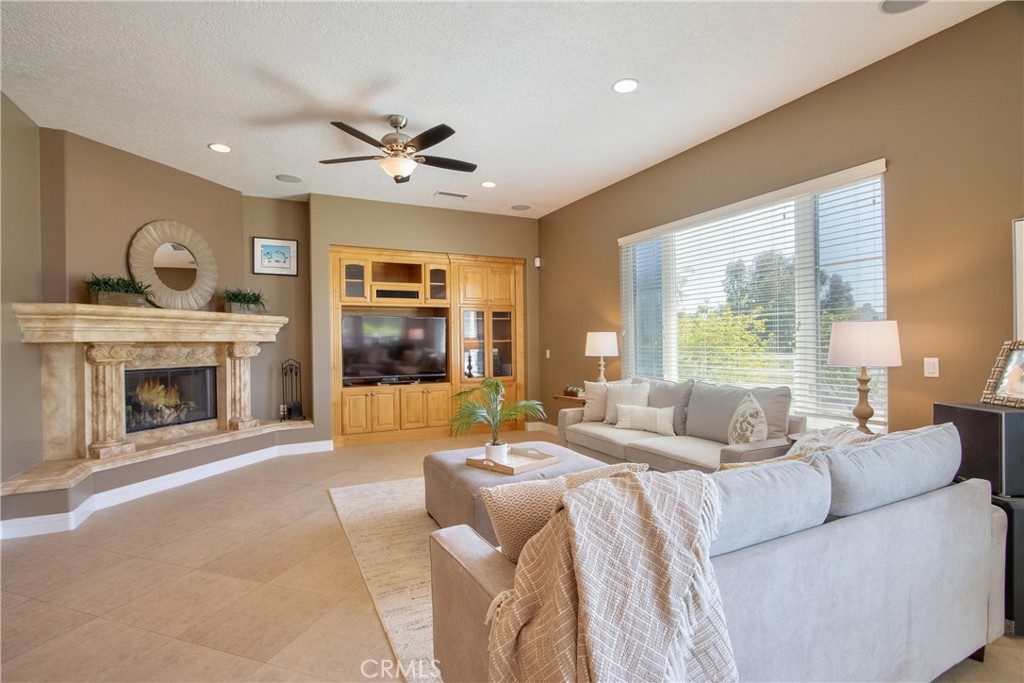 41380 La Sierra Road Temecula, CA 92591 - Photo 12 of 72 a living room with furniture and a fireplace