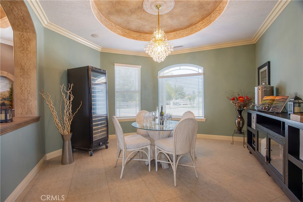 41380 La Sierra Road Temecula, CA 92591 - Photo 22 of 72 a dining room with furniture a chandelier and window