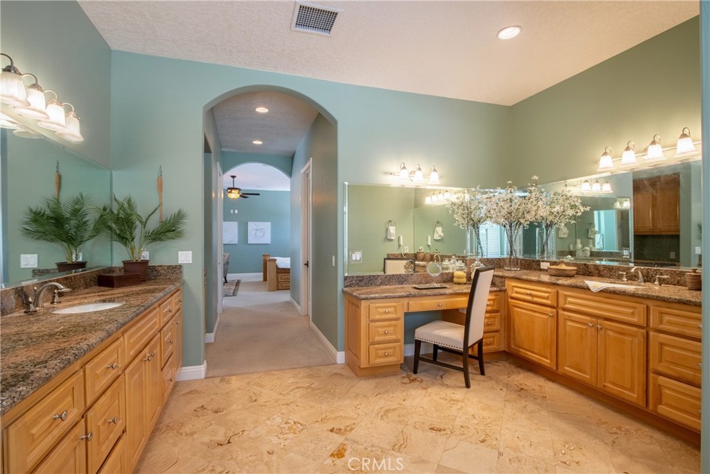 41380 La Sierra Road Temecula, CA 92591 - Photo 26 of 72 a large bathroom with a sink a large mirror and a shower