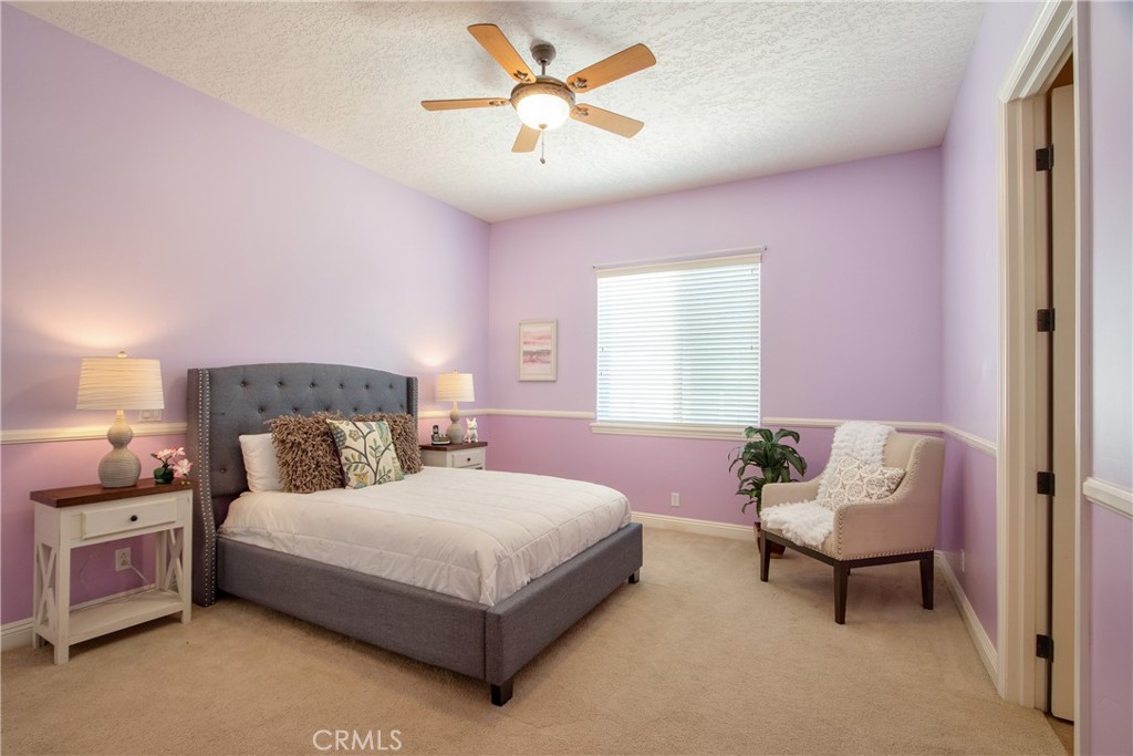 41380 La Sierra Road Temecula, CA 92591 - Photo 31 of 72 a bedroom with a bed and a couch