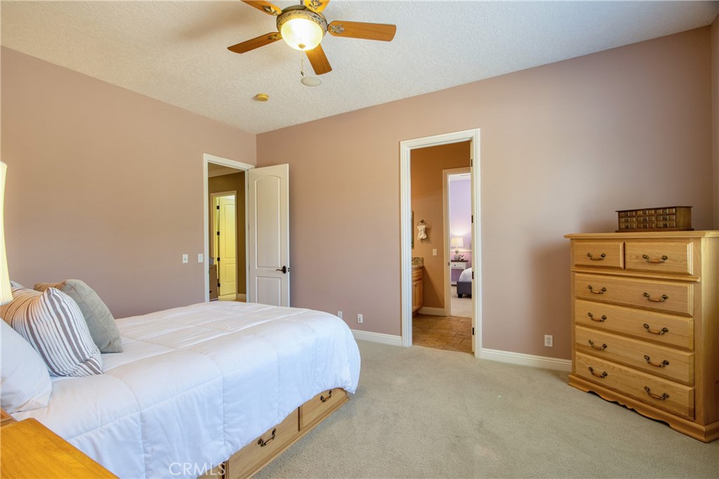 41380 La Sierra Road Temecula, CA 92591 - Photo 36 of 72 a bedroom with a bed and ceiling fan