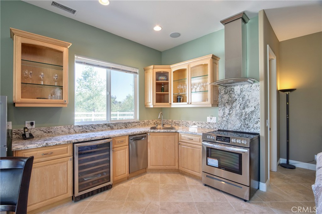 41380 La Sierra Road Temecula, CA 92591 - Photo 42 of 72 a kitchen with a stove sink and window