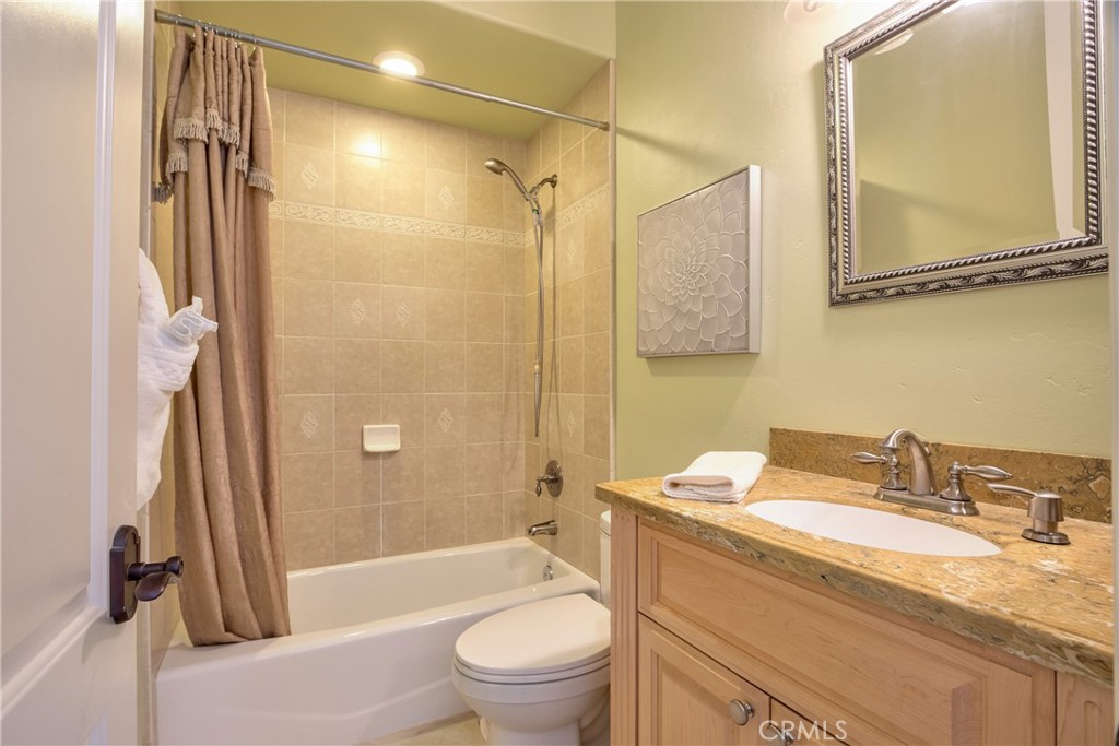 41380 La Sierra Road Temecula, CA 92591 - Photo 43 of 72 a bathroom with a granite countertop sink toilet and shower