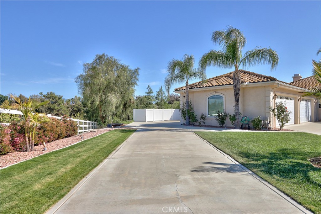 41380 La Sierra Road Temecula, CA 92591 - Photo 56 of 72 a view of a house with a yard and potted plants