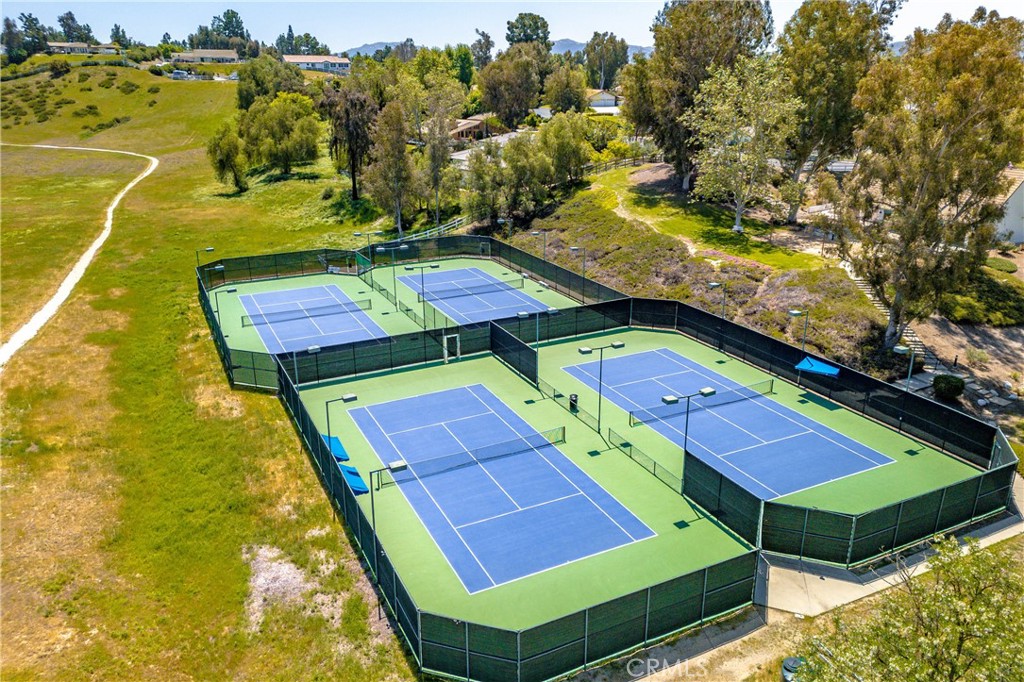 41380 La Sierra Road Temecula, CA 92591 - Photo 67 of 72 a view of a tennis ground with a pool