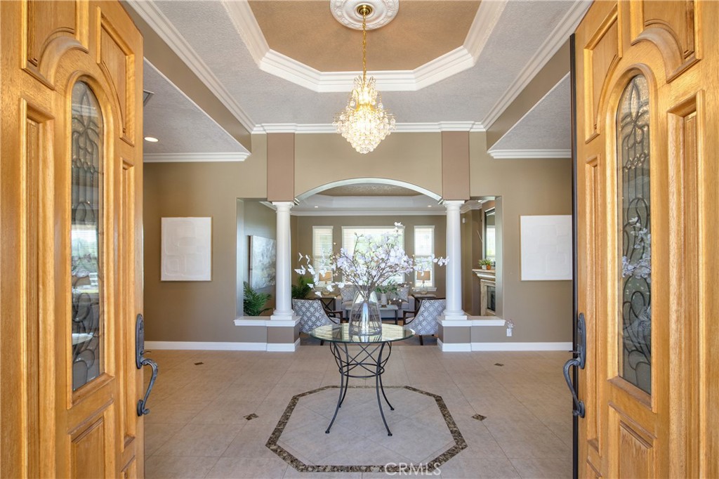 41380 La Sierra Road Temecula, CA 92591 - Photo 9 of 72 a view of a dining room with furniture wooden floor and chandelier