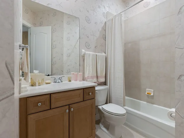 a view of a patio with chairs and plants