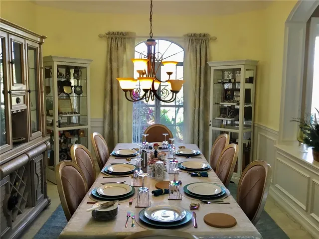 a kitchen with stainless steel appliances kitchen island granite countertop a refrigerator and a stove top oven