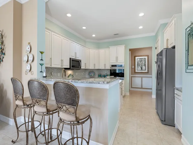 a bathroom with a tub shower sink and mirror