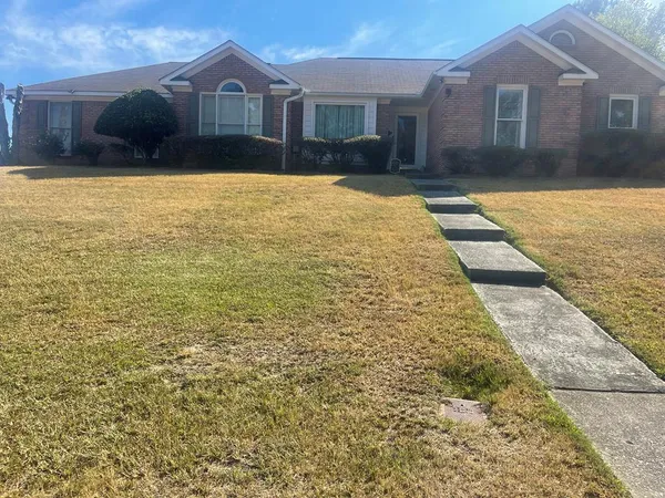a front view of a house having yard
