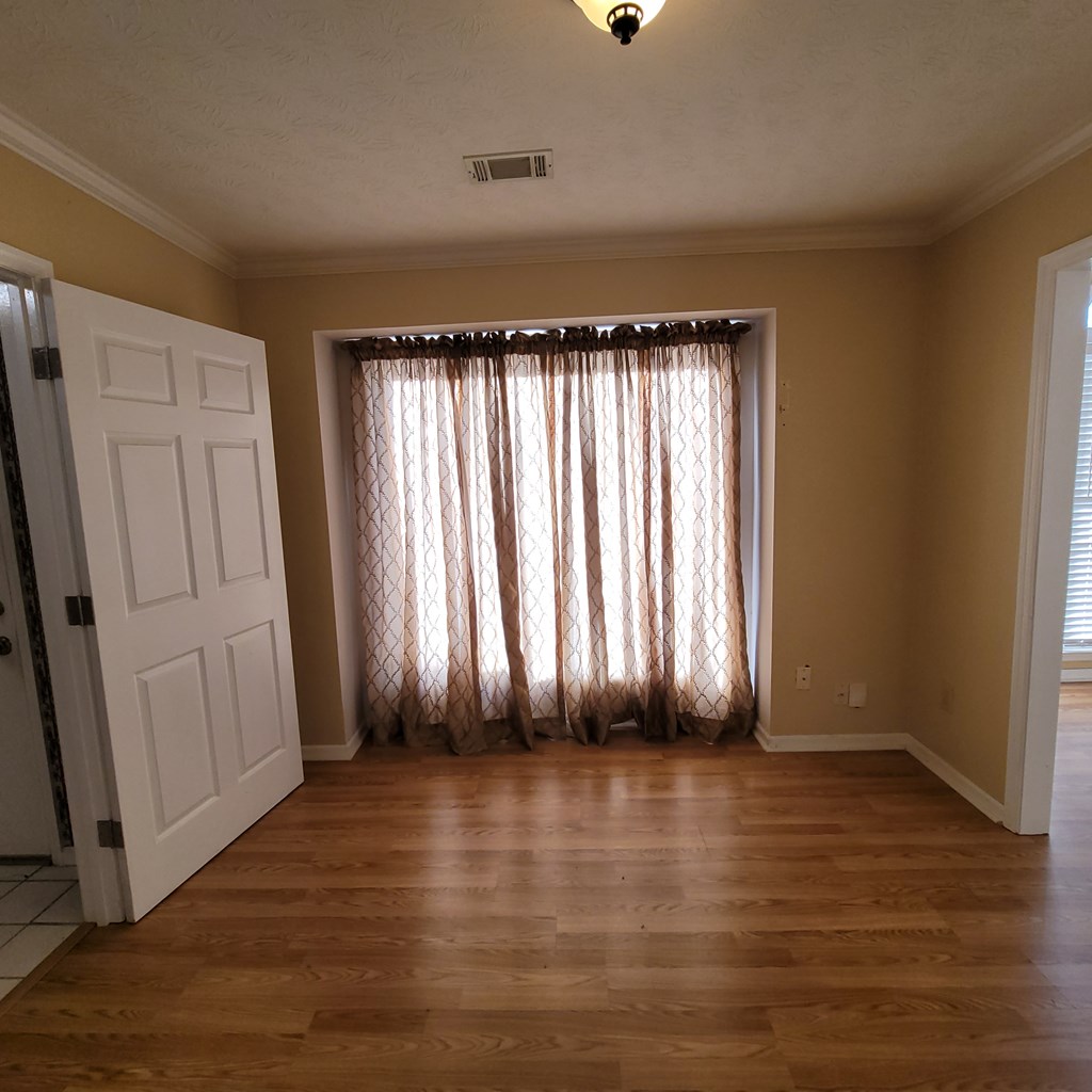 532 Paula Court Columbus, GA 31907 - Photo 12 of 54 an empty room with wooden floor and windows