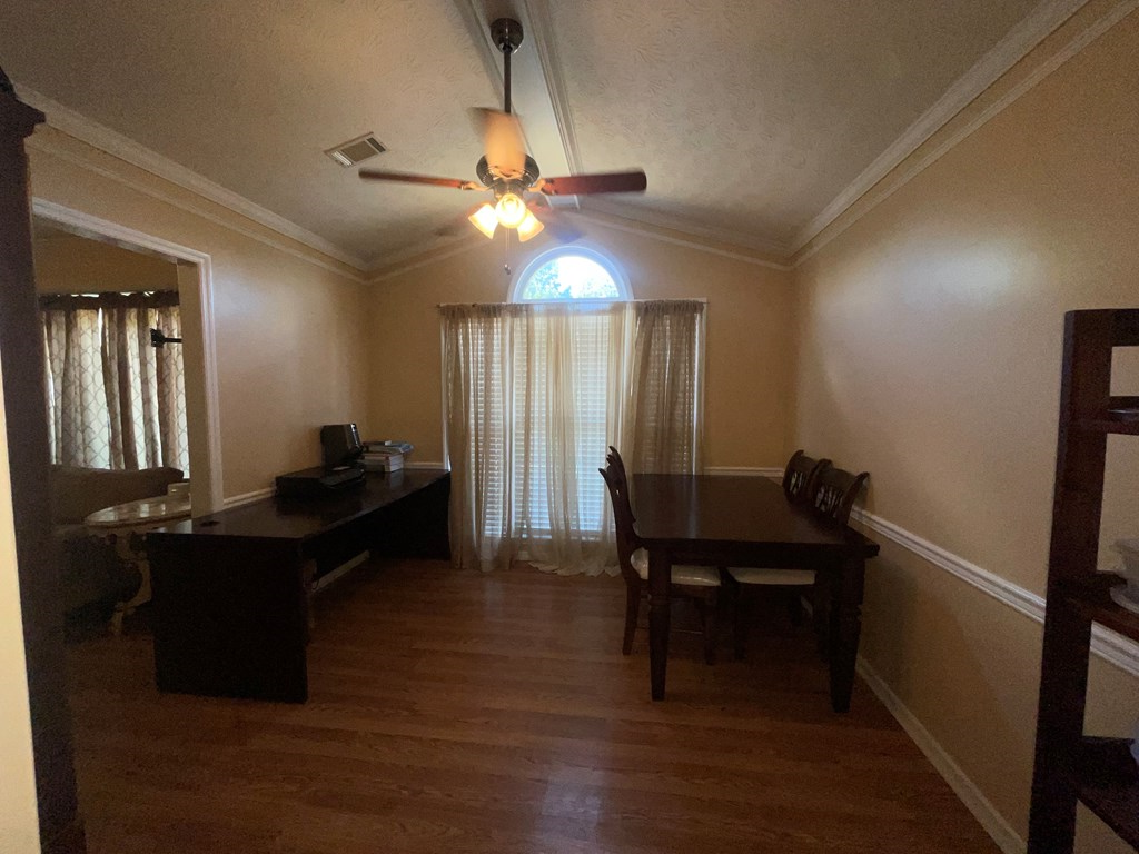 532 Paula Court Columbus, GA 31907 - Photo 17 of 54 a room with a table chairs and a wooden floor